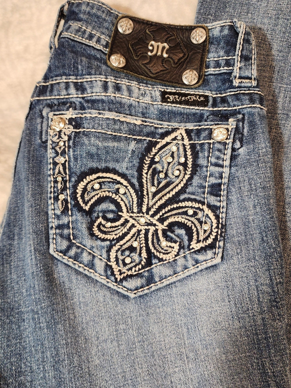 Miss Me Light Blue Denim Bootcut Jeans with Embroidered Fleur-de-Lis Pocket